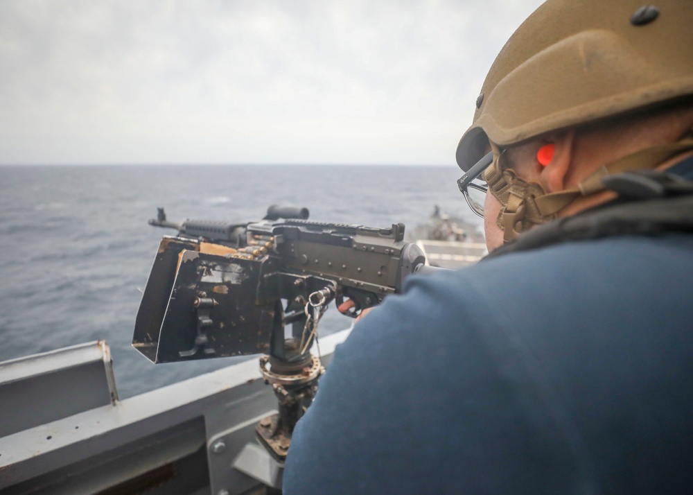 Sailor Fires Machine Gun