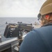 Sailor Fires Machine Gun