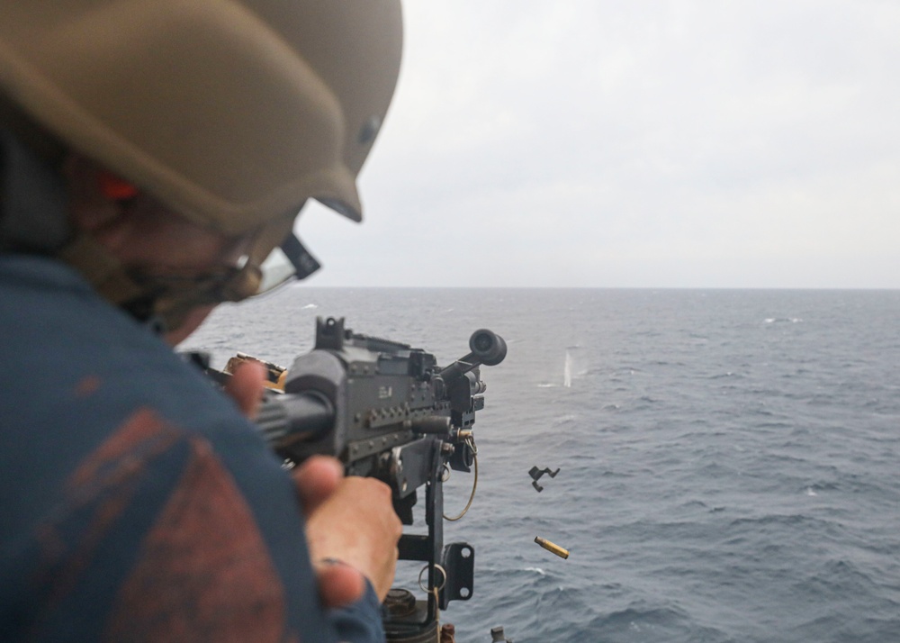 Sailor Fires Machine Gun