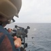 Sailor Fires Machine Gun