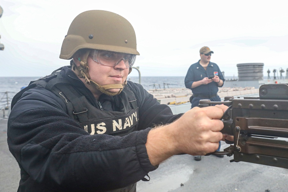 Sailor Fires Machine Gun