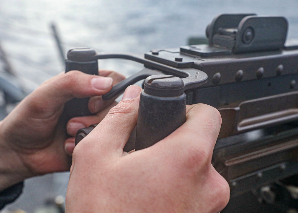 Sailor Fires Machine Gun