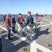 Sailors Carry Simulated Medical Casualty