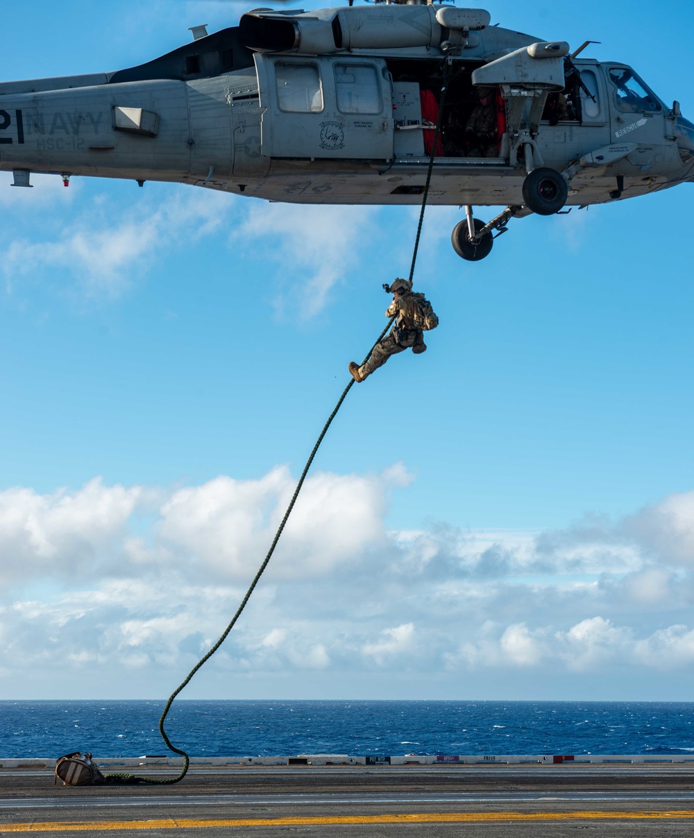 Explosive Ordnance Disposal Mobile Unit 5 conducts maritime interdiction training with Helicopter Sea Combat Squadron (HSC) 12