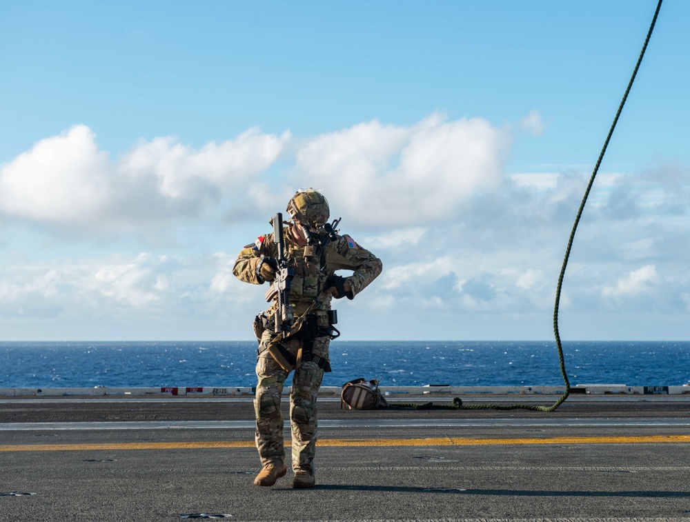 Explosive Ordnance Disposal Mobile Unit 5 conducts maritime interdiction training with Helicopter Sea Combat Squadron (HSC) 12