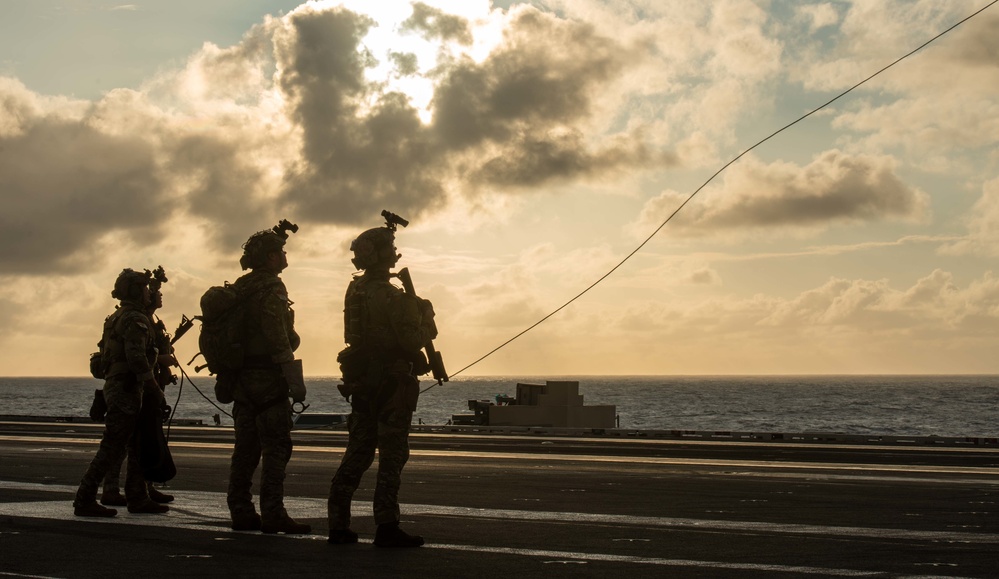 Explosive Ordnance Disposal Mobile Unit 5 conducts maritime interdiction training with Helicopter Sea Combat Squadron (HSC) 12