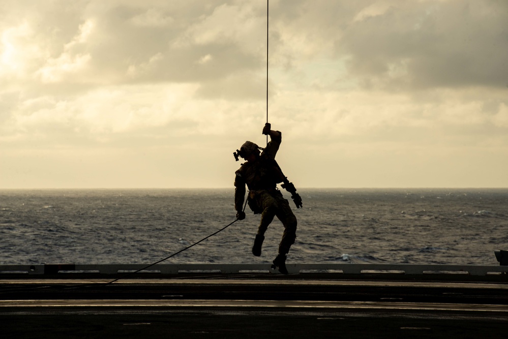 Explosive Ordnance Disposal Mobile Unit 5 conducts maritime interdiction training with Helicopter Sea Combat Squadron (HSC) 12