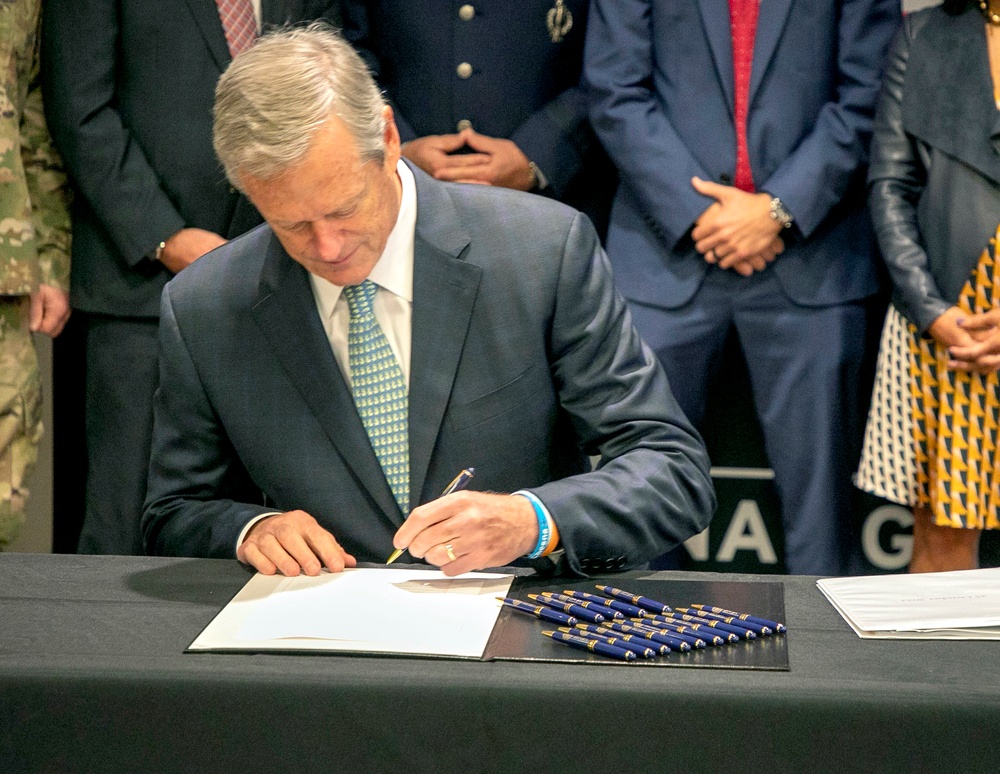 Massachusetts Governor Charlie Baker signs SPEED Act at Massachusetts National Guard Headquarters