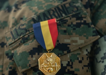 Hawaii-based U.S. Marine awarded for saving life of woman swept off cliff into ocean