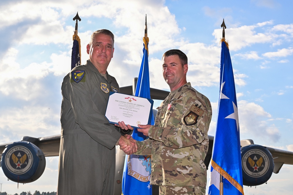 621st Contingency Response Wing Airmen are awarded at distinguished flying cross and bronze star medal ceremony