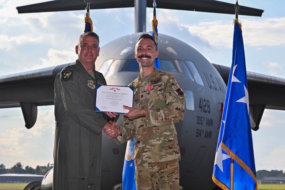 621st Contingency Response Wing Airmen are awarded at distinguished flying cross and bronze star medal ceremony