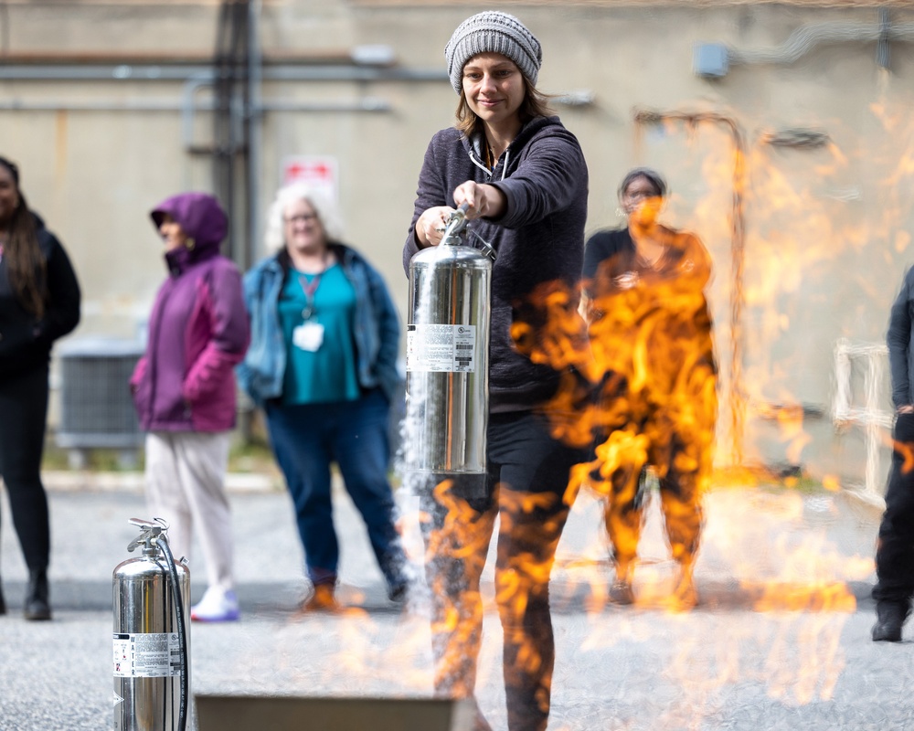 Learning to use a fire extinguisher