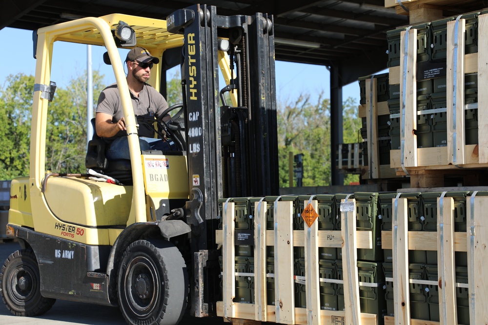 Forklift Operator Preparing Ammo for Distribution