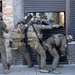 A Special Response Team (SRT) from Homeland Security Investigations (HSI) peels open a security door while serving a warrant as part of Operation Boiling Point