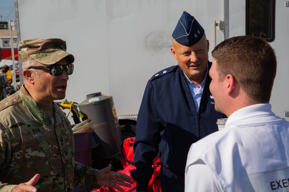 U.S. Army Maj. Gen. Van, commanding general Joint Task Force Civil Support and U.S. Air Force Maj. Gen. Tom Gradowksi, commander Georgia Air National Guard speak with Atlanta-Fulton County Emergency Management Agency Operations Battalion Chief