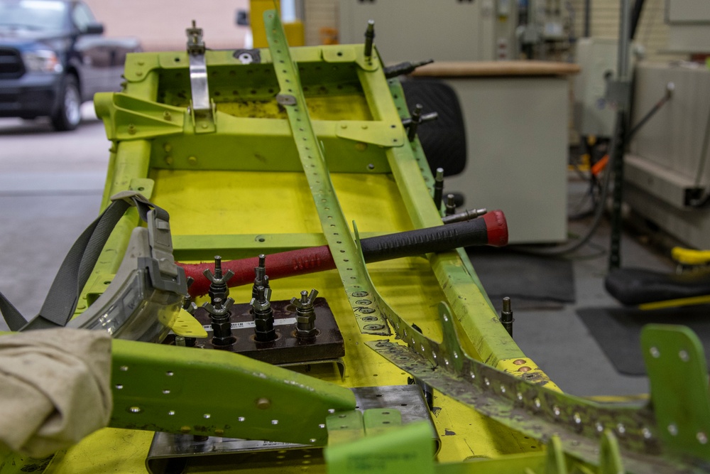 Maintenance Airmen repair APU doors