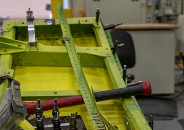 Maintenance Airmen repair APU doors
