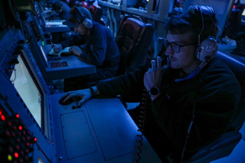 Sailors Stand Watch In Combat Information Center On Board USS Higgins