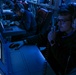 Sailors Stand Watch In Combat Information Center On Board USS Higgins