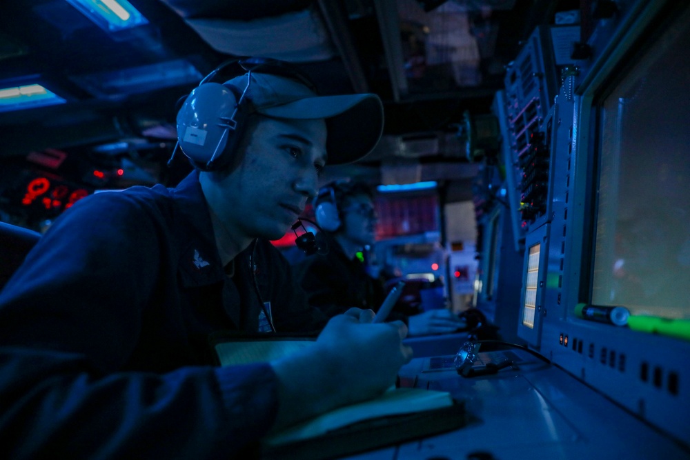 Sailors Stand Watch In Combat Information Center On Board USS Higgins