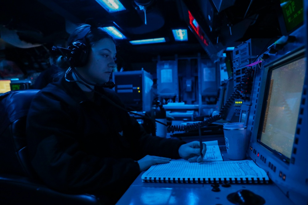 Sailors Stand Watch In Combat Information Center On Board USS Higgins