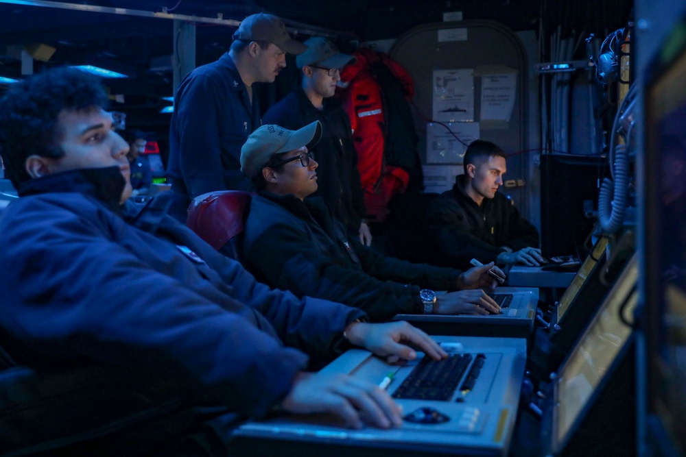 Sailors Stand Watch In Combat Information Center On Board USS Higgins