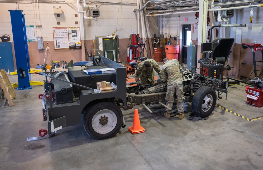 Photo of 116th Logistics Readiness Squadron Airmen working on Bobtail truck engine