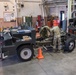 Photo of 116th Logistics Readiness Squadron Airmen working on Bobtail truck engine