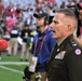 653rd RSG commander conducts reenlistment ceremony at NFL game