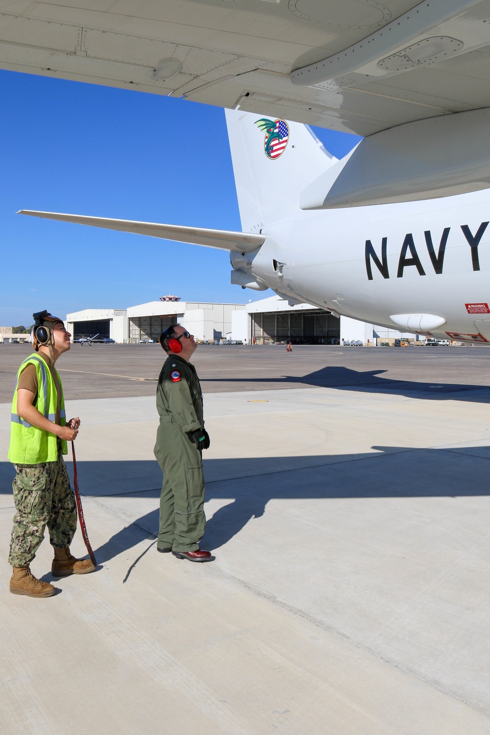 Commanding Officer of VP-4 Pre-flights a P8-A Poseidon