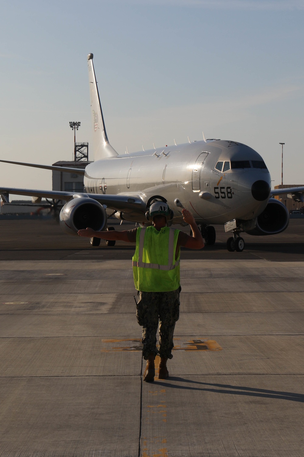 Commanding Officer of VP-4 Pre-flights a P8-A Poseidon