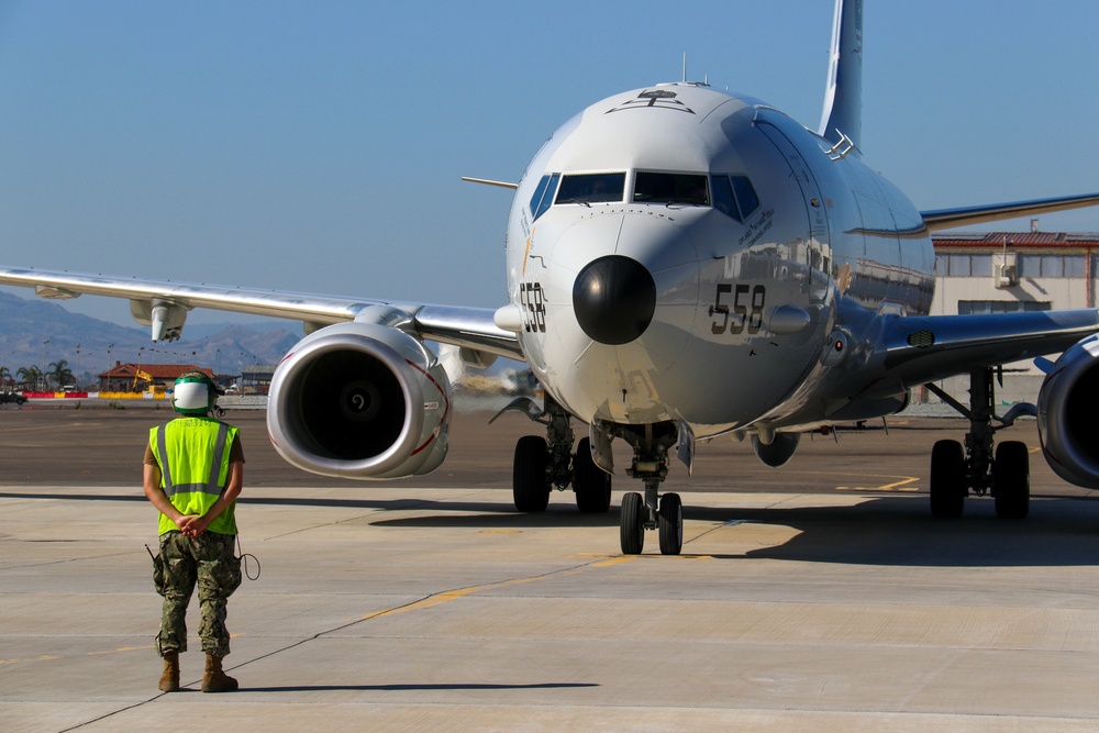 Commanding Officer of VP-4 Pre-flights a P8-A Poseidon