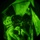 TACP Lightning Challenge 2022 A night vision image captured through what appears to be a night vision device (NVD), showing military personnel partially obscured by a large translucent material, likely a parachute canopy. The characteristic circular vignette and green monochromatic tones confirm this was captured using night vision optics. At least two individuals in full tactical gear are visible beneath or within the material.