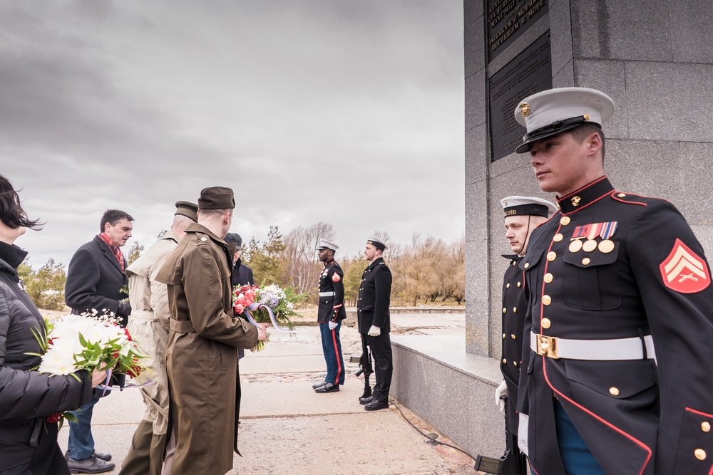 MSGs participate in a commemorative flower laying ceremony in Latvia