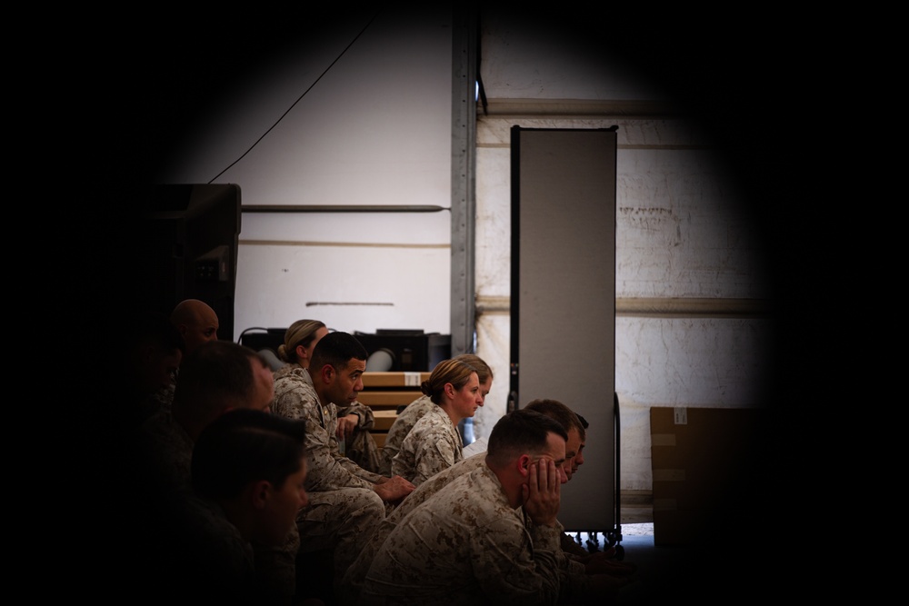 U.S. Marines critique each other during peer evaluated presentation