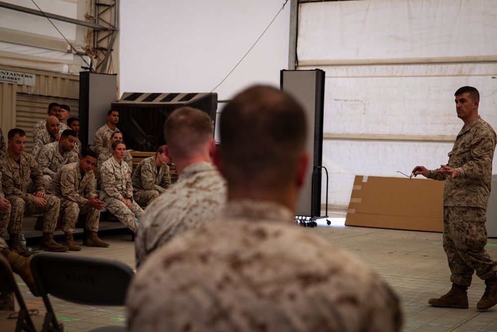 U.S. Marines critique each other during peer evaluated presentation