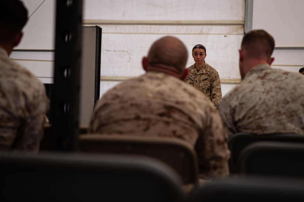 U.S. Marines critique each other during peer evaluated presentation
