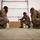U.S. Marines critique each other during peer evaluated presentation U.S. Marines critique each other during peer evaluated presentation