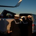 Sailors transfer the remains of Radioman 3rd Class Charles A. Montgomery into a hearse bound for his final resting place.