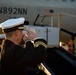 Sailors transfer the remains of Radioman 3rd Class Charles A. Montgomery into a hearse bound for his final resting place.