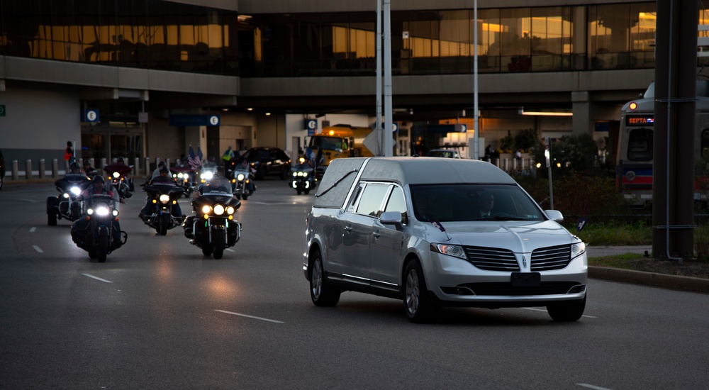 Radioman 3rd Class Charles A. Montgomery is escorted by riders from Warrior Escort en route to his final resting place.