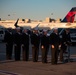 Sailors prepare to receive the remains during the dignified transfer of remains of Radioman 3rd Class Charles A. Montgomery.