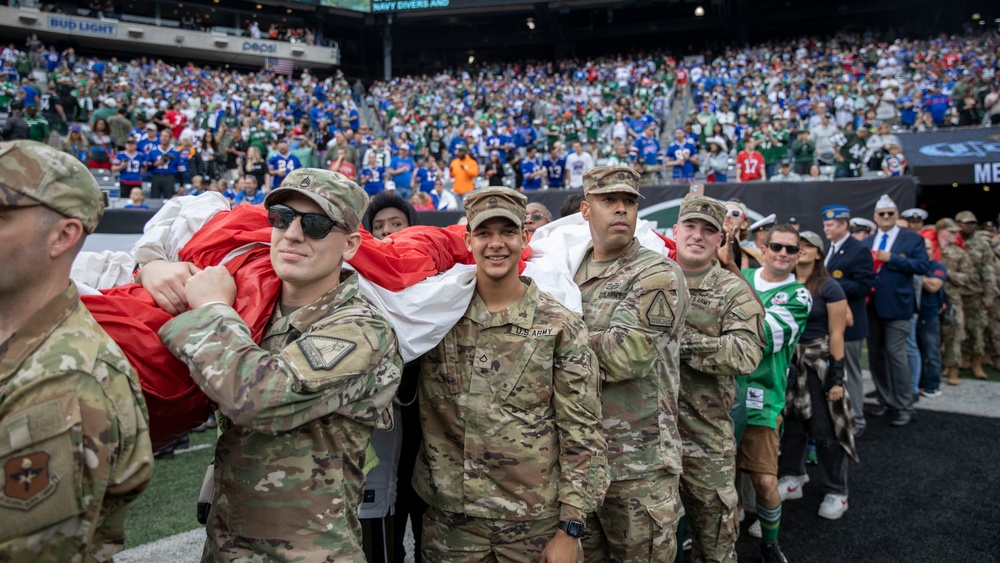 DVIDS - Images - Service Members Unfurl Flag at NY Jets First Home