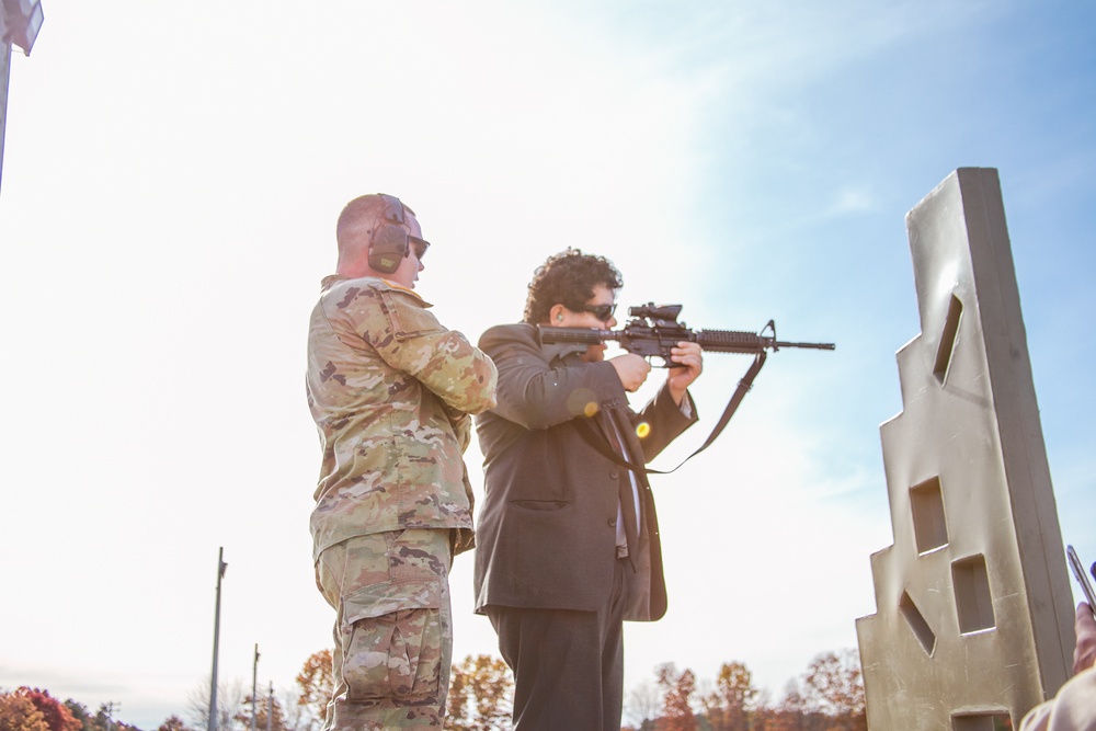 SGT Fletcher monitors as one of the Staff Delegates fires an M4 for for the first time.