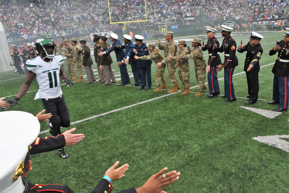 New Jersey National Guard Soldiers hold the American Flag along side other  service members and veterans at MetLife Stadium in East Rutherford, New  Jersey, Nov. 6, 2022. Soldiers of the New Jersey