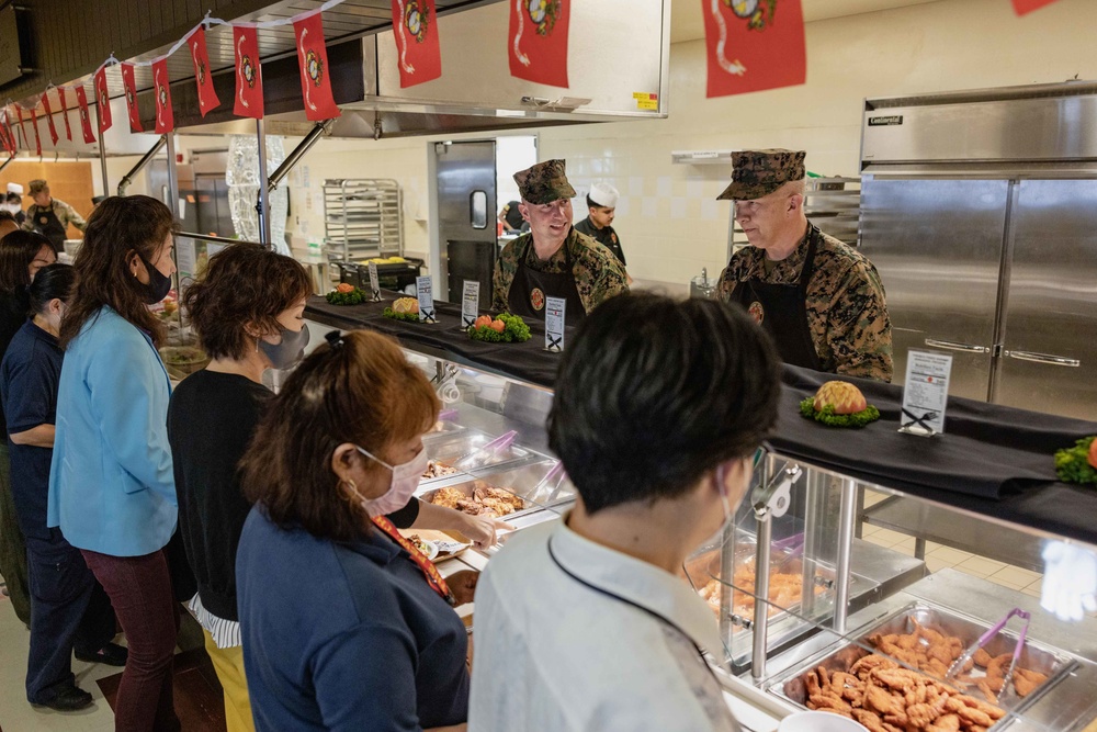 US Marines, Sailors, and civilians celebrate the 247th Marine Corps Birthday at the Camp Foster Mess Hall