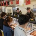US Marines, Sailors, and civilians celebrate the 247th Marine Corps Birthday at the Camp Foster Mess Hall
