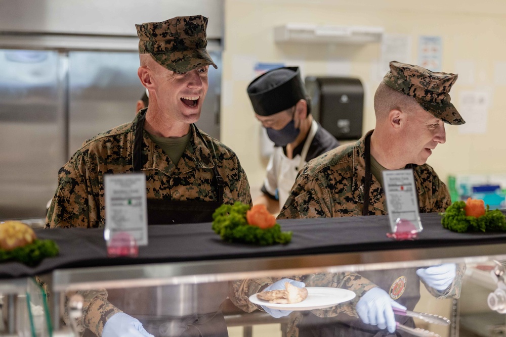 US Marines, Sailors, and civilians celebrate the 247th Marine Corps Birthday at the Camp Foster Mess Hall