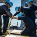 Sailor prepare for barricade rigging drills