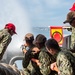 Sailors run damage control drills on the fantail of USS Carl Vinson